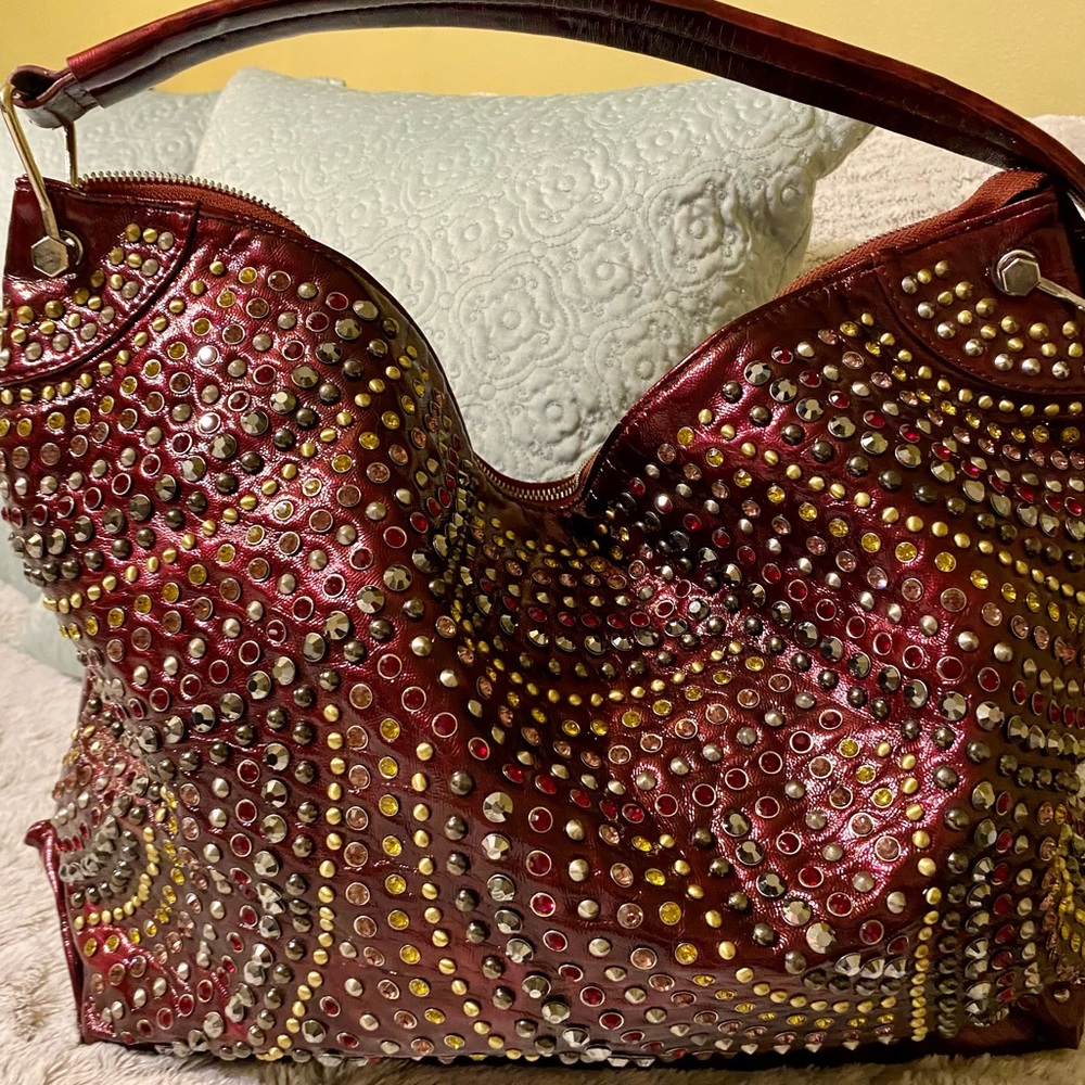 Beautiful metallic maroon color, "Blue Elegance" brand crystal studded handbag.
